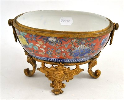 Lot 156 - An Imari oval bowl, later clobbered, in gilt metal frame