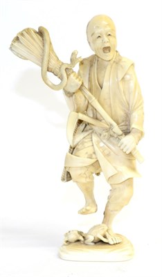 Lot 218 - A Japanese Ivory Okimono, Meiji period, as a farmer holding a brush containing a snake, two...