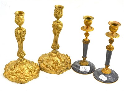 Lot 173 - Pair of cast gilt brass candlesticks and another marble, gilt and brass pair (4)