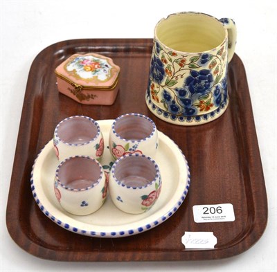 Lot 206 - A Poole pottery five piece egg cups and stand, a gilt metal mounted trinket box and a Thorne mug