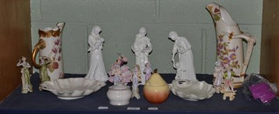 Lot 232 - Two Royal Worcester blush ivory ewers, three Worcester figures, decorative bisque figures, etc