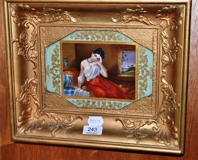 Lot 243 - A 19th century painted porcelain plaque depicting a lady clutching a dove