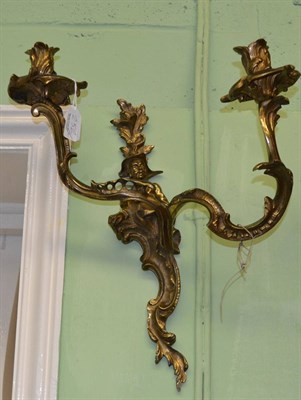 Lot 252 - Pair of cast bronze twin branch wall lights