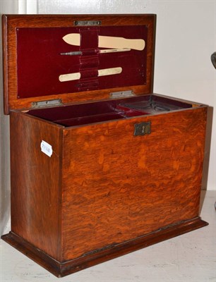 Lot 259 - An oak stationery box