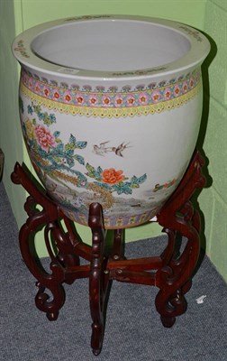 Lot 260 - A 20th century Republic era Chinese famille rose fish bowl and wood stand