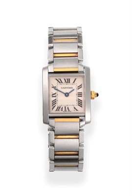 Lot 235 - A Lady's Steel and Gold Wristwatch, signed Cartier, model: Tank Francaise, ref: 2384, circa...