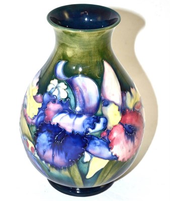 Lot 291 - A Walter Moorcroft orchid and spring flowers vase, impressed factory marks and blue painted...