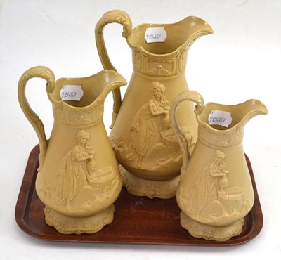 Lot 296 - A set of three Victorian Alcock relief moulded jugs