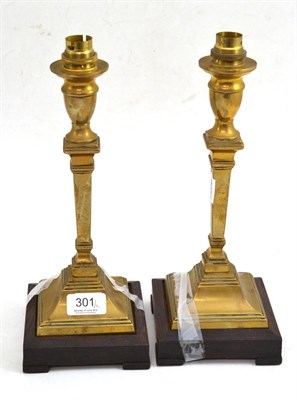 Lot 301 - A pair of brass converted candlesticks