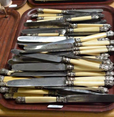 Lot 304 - Set of forty-eight Victorian steel bladed table and dessert knives with ivory handles stamped...