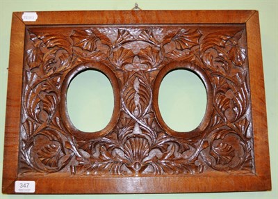 Lot 347 - An Arts & Crafts carved oak double photograph frame