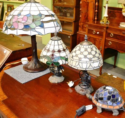 Lot 366 - Four modern Tiffany style lamps