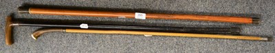 Lot 395 - A walking stick circa 1890, the panelled horn grip with boar carved boss and two other 19th century