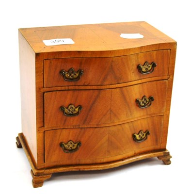 Lot 399 - Miniature walnut chest