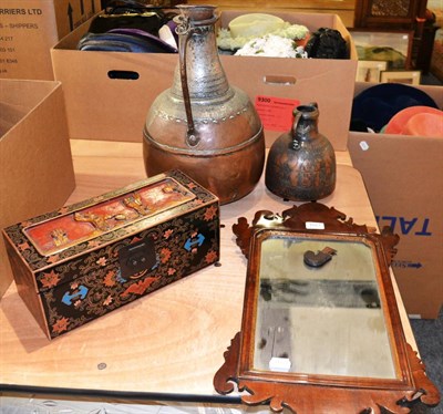 Lot 1027 - Two Middle Eastern copper flagons, a lacquer box and a Chippendale style mirror