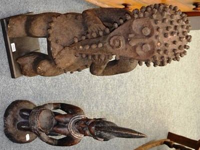 Lot 1056 - Two African carved wood figures