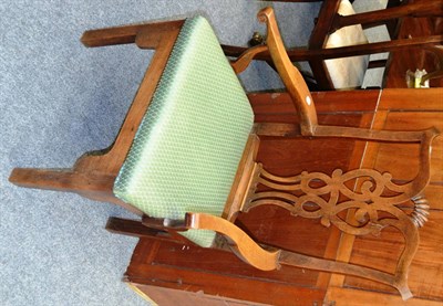 Lot 1072 - A provincial Georgian oak broad armed carver with green upholstered seat