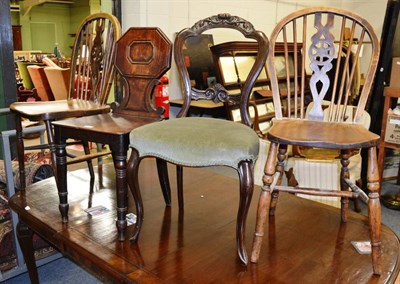 Lot 1142 - A mahogany hall chair, two wheel back chairs and a balloon back chair (4)