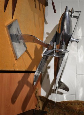 Lot 1169 - A large cast aluminium model of a biplane on stand