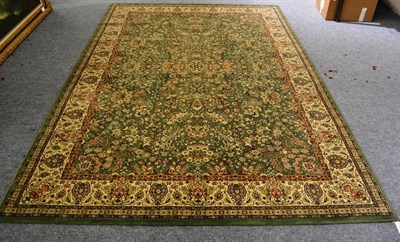 Lot 1178 - A modern green Persian style floral carpet with cream border