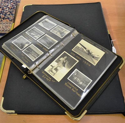 Lot 1181 - An album of photographs including images of RAF raids in Singapore in 1954, together with a...