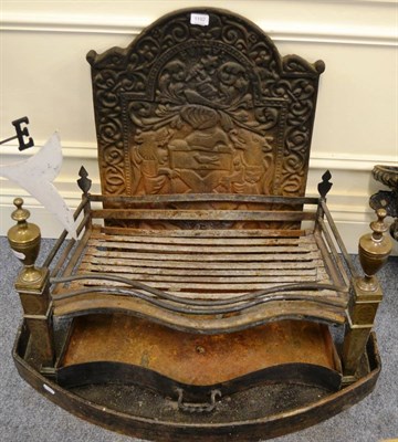 Lot 1192 - A cast iron fire back and a fire grate with brass mounts to the front