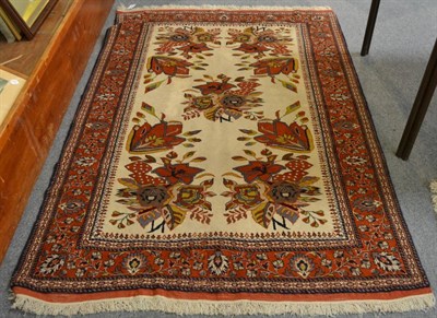 Lot 1280 - Kuchan rug, Khorasan Province, the ivory field of floral sprays enclosed by terracotta borders,...