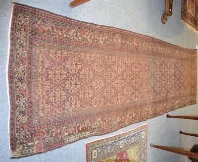 Lot 1290 - Sarab runner, Persian Azerbaijan, the camel lattice field enclosed by floral borders, 344cm by...