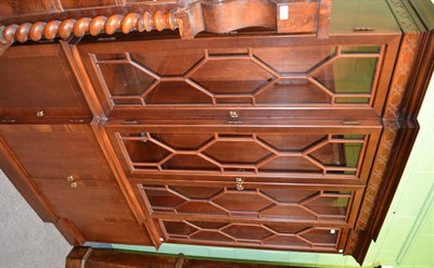 Lot 1305 - A mahogany break fronted bookcase in Chinese Chippendale style