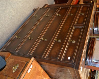 Lot 1319 - An oak five height chest of drawers