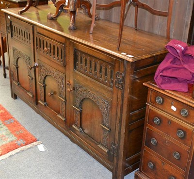 Lot 1323 - A 20th century oak sideboard in 17th century style, with central drawer and cupboard, flanked...