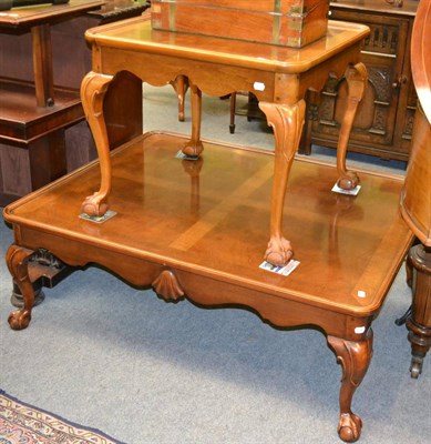 Lot 1331 - A 20th century walnut coffee table on ball and claw feet and a similar smaller coffee table