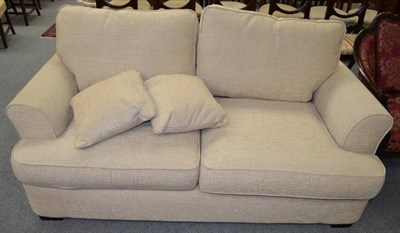 Lot 1347 - A cream upholstered sofa bed