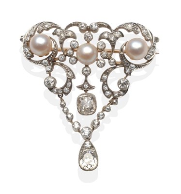 Lot 291 - A Cultured Pearl and Diamond Brooch, three graduated pearls to an openwork scroll frame set...