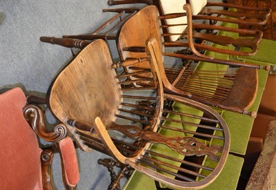 Lot 1357 - A stick back country armchair and a wheel back Windsor armchair (2)