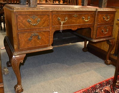 Lot 1367 - Walnut five drawer leather top desk