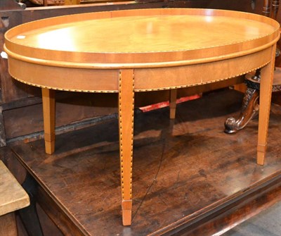 Lot 1376 - A satinwood coffee table with barber pole stringing