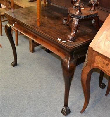 Lot 1377 - A 19th century mahogany table on claw and ball feet