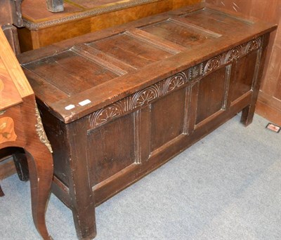 Lot 1380 - A late 18th century carved oak blanket chest