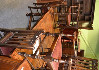 Lot 1381 - A draw leaf oak dining table on barley twist supports and six dining chairs (4+2)