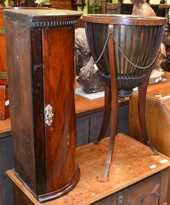 Lot 1390 - A mahogany corner cupboard and a jardiniere stand