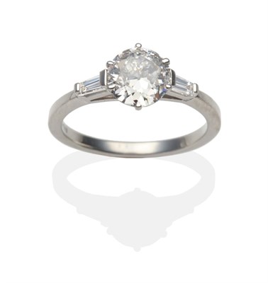 Lot 298 - A Platinum Diamond Solitaire Ring, an old cut diamond in a claw setting between tapered...