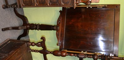 Lot 1412 - A George IV rosewood display stand or easel, comprising a panelled rectangular board mounted...