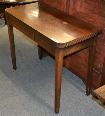 Lot 1428 - A mahogany fold-over tea table