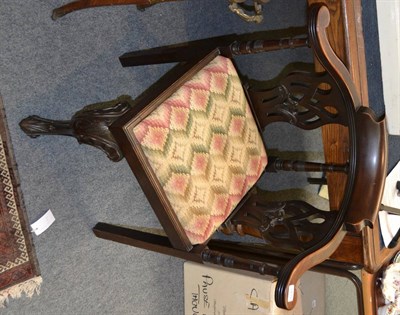 Lot 1439 - A George III mahogany corner chair with drop in seat