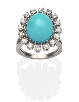 Lot 304 - A Turquoise and Diamond Cluster Ring, an oval cabochon turquoise within a border of old cut...