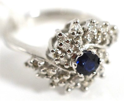 Lot 5022 - An 18ct white gold sapphire and diamond cluster ring