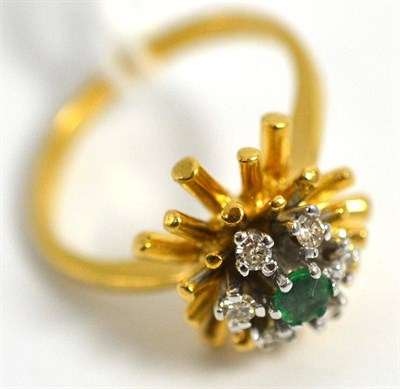 Lot 5023 - An 18ct gold emerald and diamond cluster ring, 1972