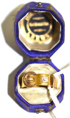Lot 5029 - Gents gold buckle ring with single diamond
