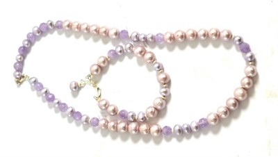 Lot 5030 - An amethyst and cultured pearl necklace and bracelet